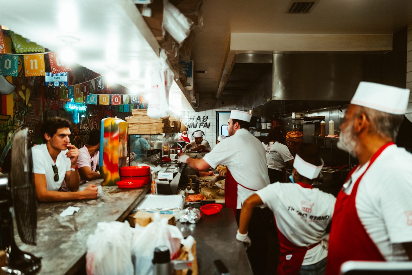 A busy kitchen and counter during service